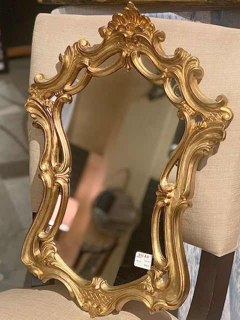 Unique and fancy gold toned mirror