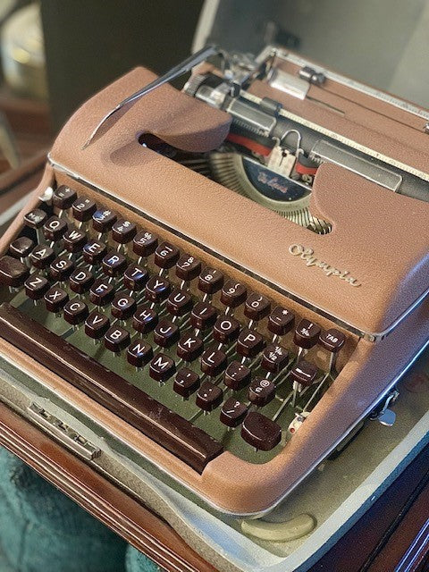 Olympia vintage portable typewriter with case, 1950's